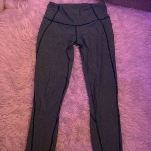 Lulu lemon leggings.  Green with thin white stripes.  Super cute and comfy! Sz 6